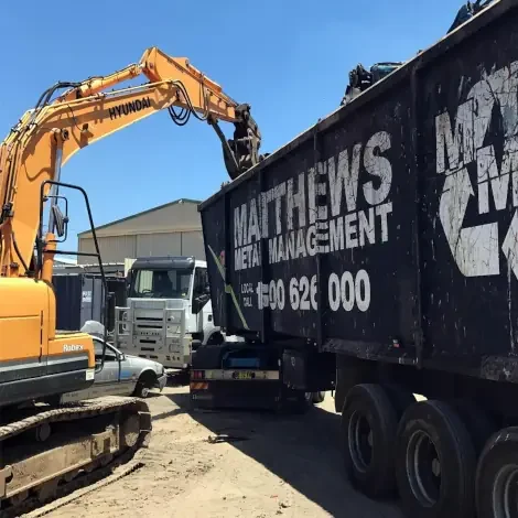 loading scrap metal bins